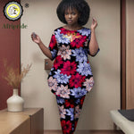 Woman wearing a colorful floral dress with a minimal background